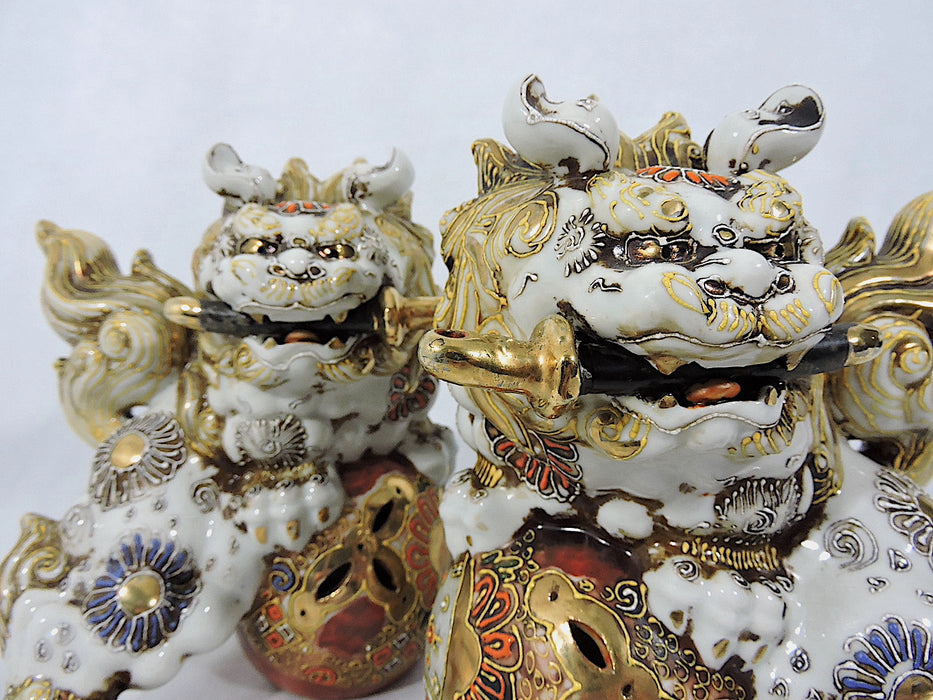 Japanese Showa Era White & Gold Kutani Porcelain Foo Lions (Shishi) With Swords - a Pair, Signed